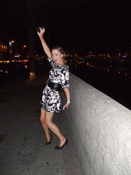 Girl in black and white silk dress with thick black belt